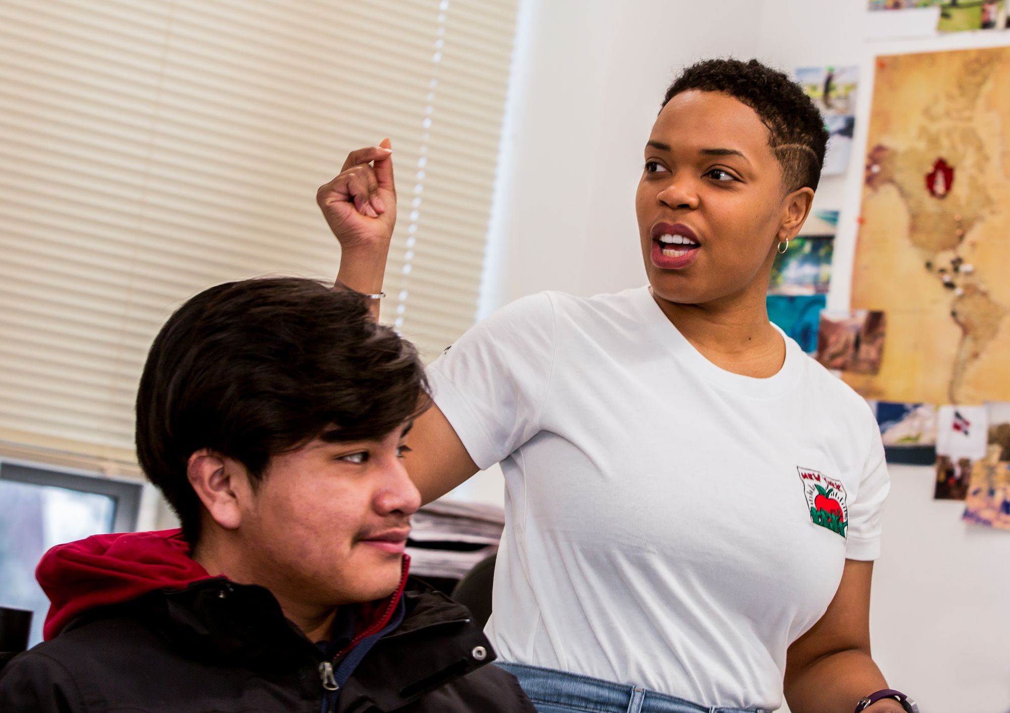 Teacher talks in front of the classroom. 