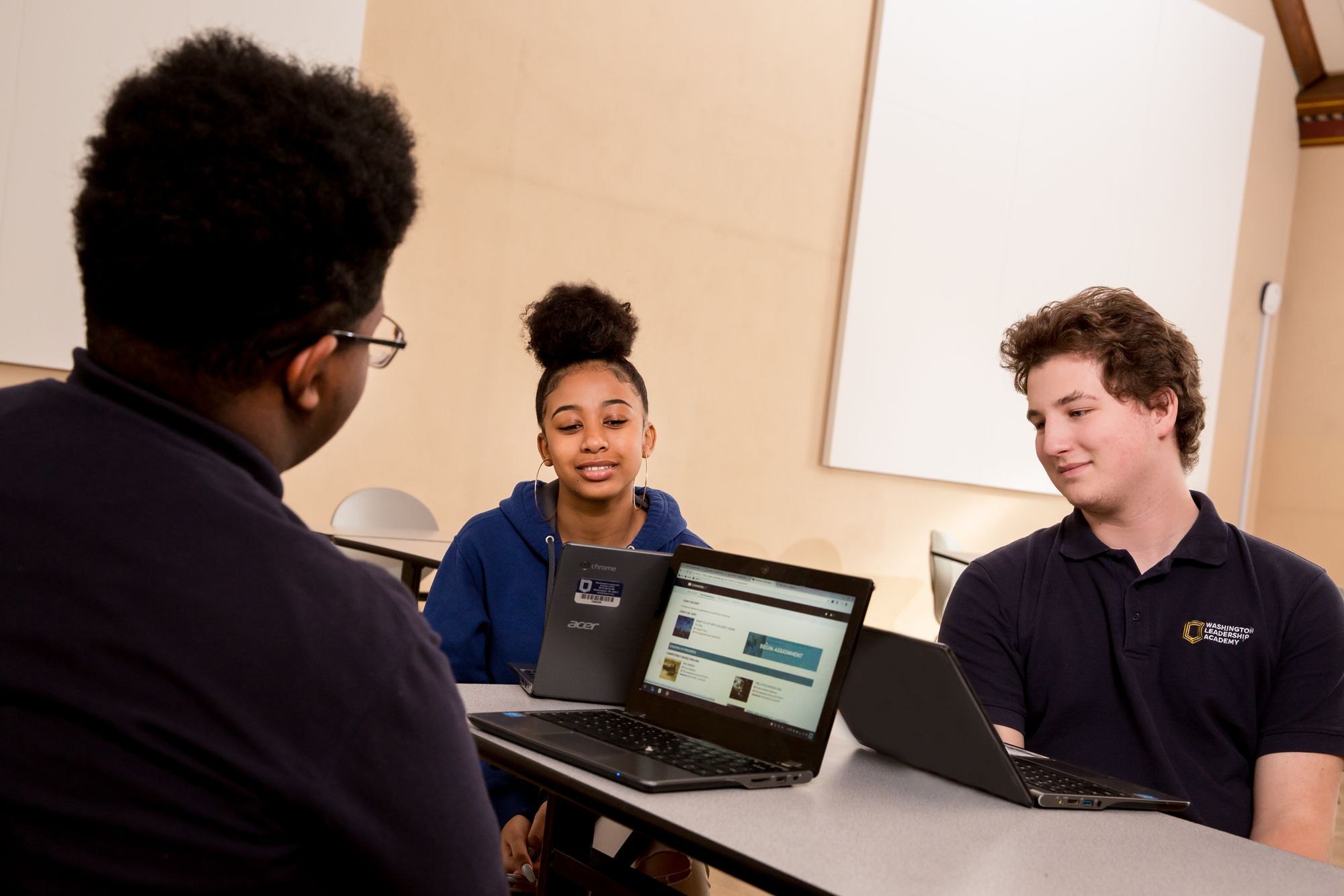 Students complete CommonLit lesson on laptops. 