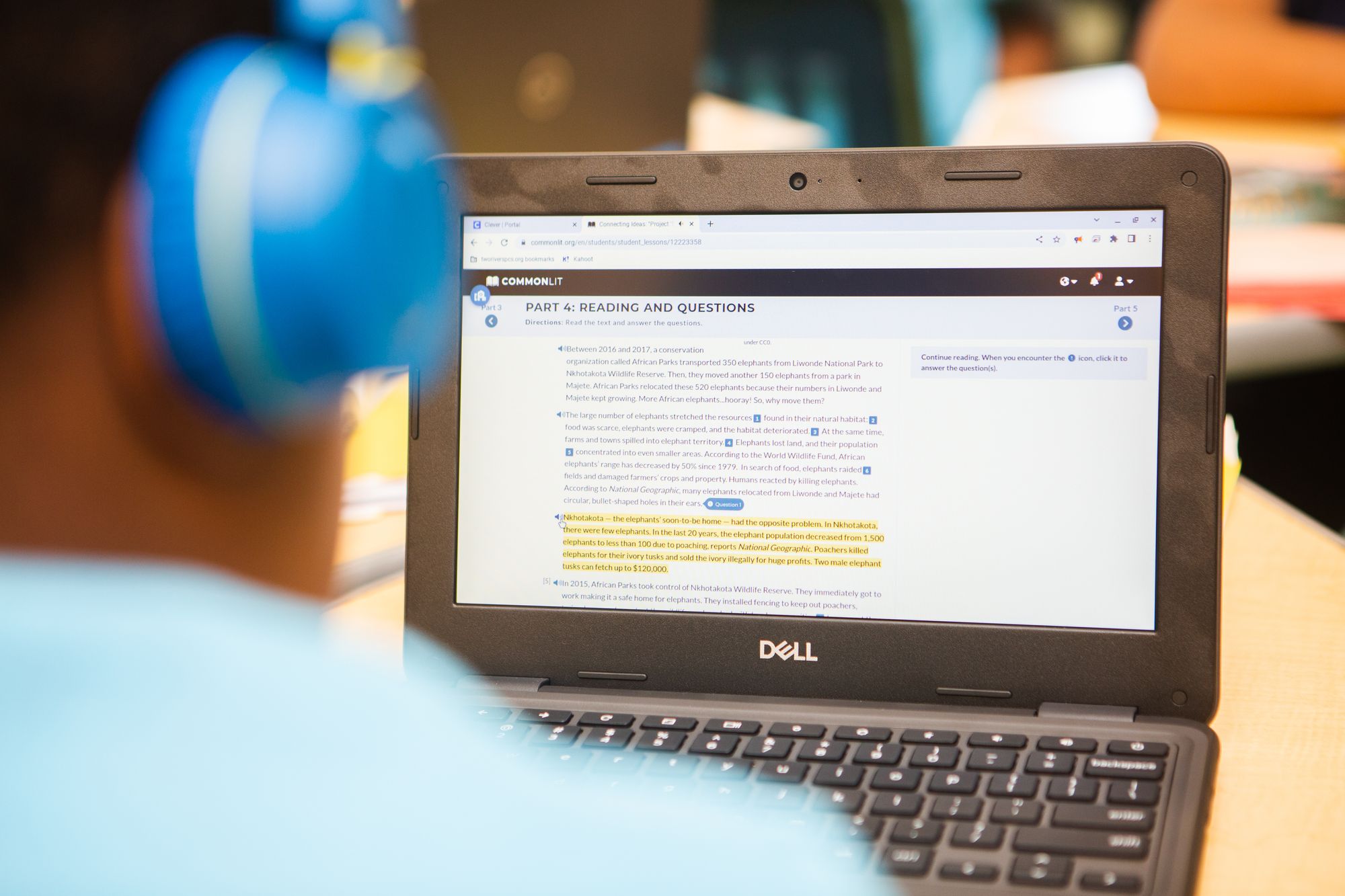 Student reading a passage on a laptop computer screen