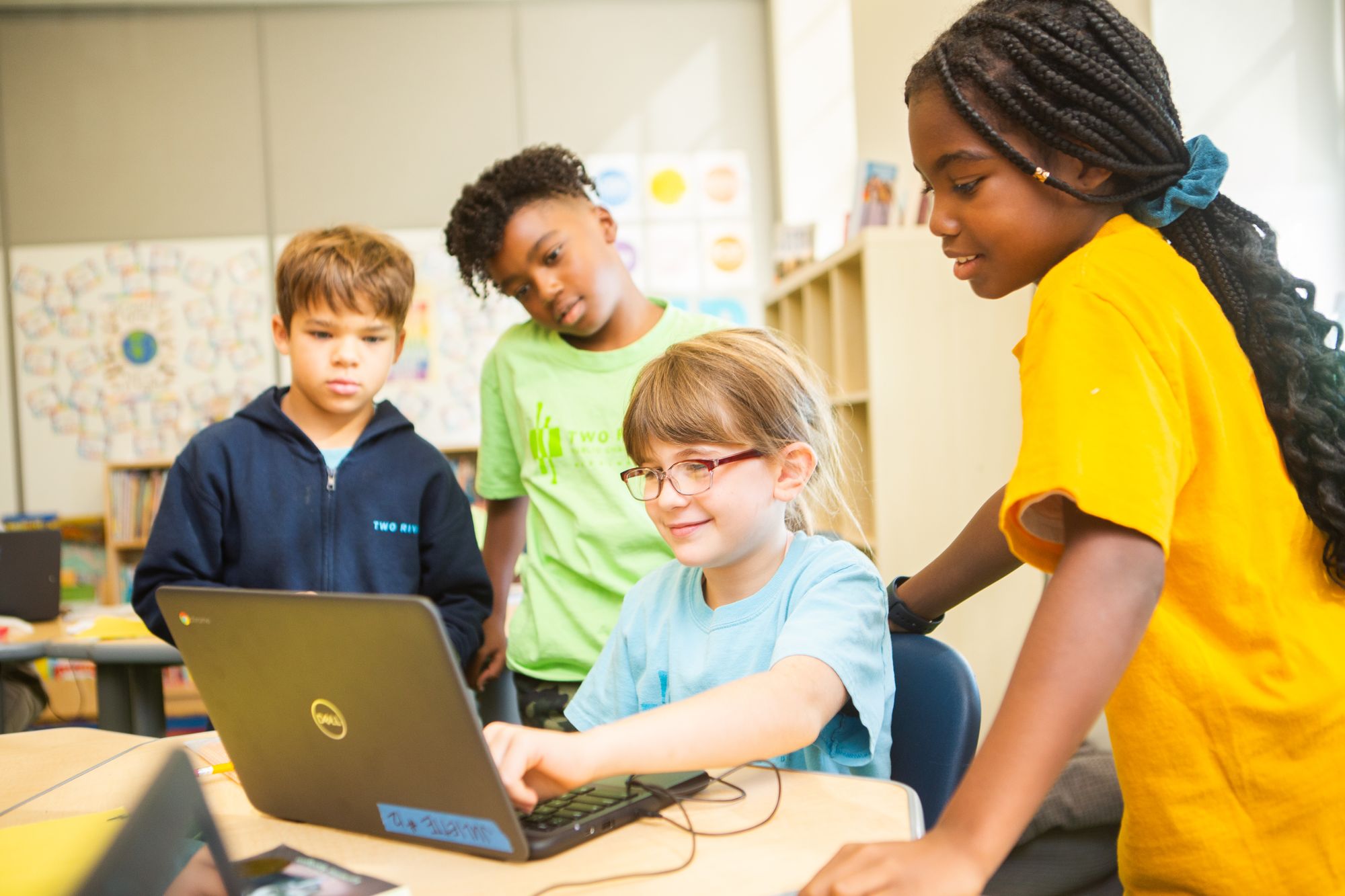 A student and teacher work on a CommonLit 360 lesson on the computer.