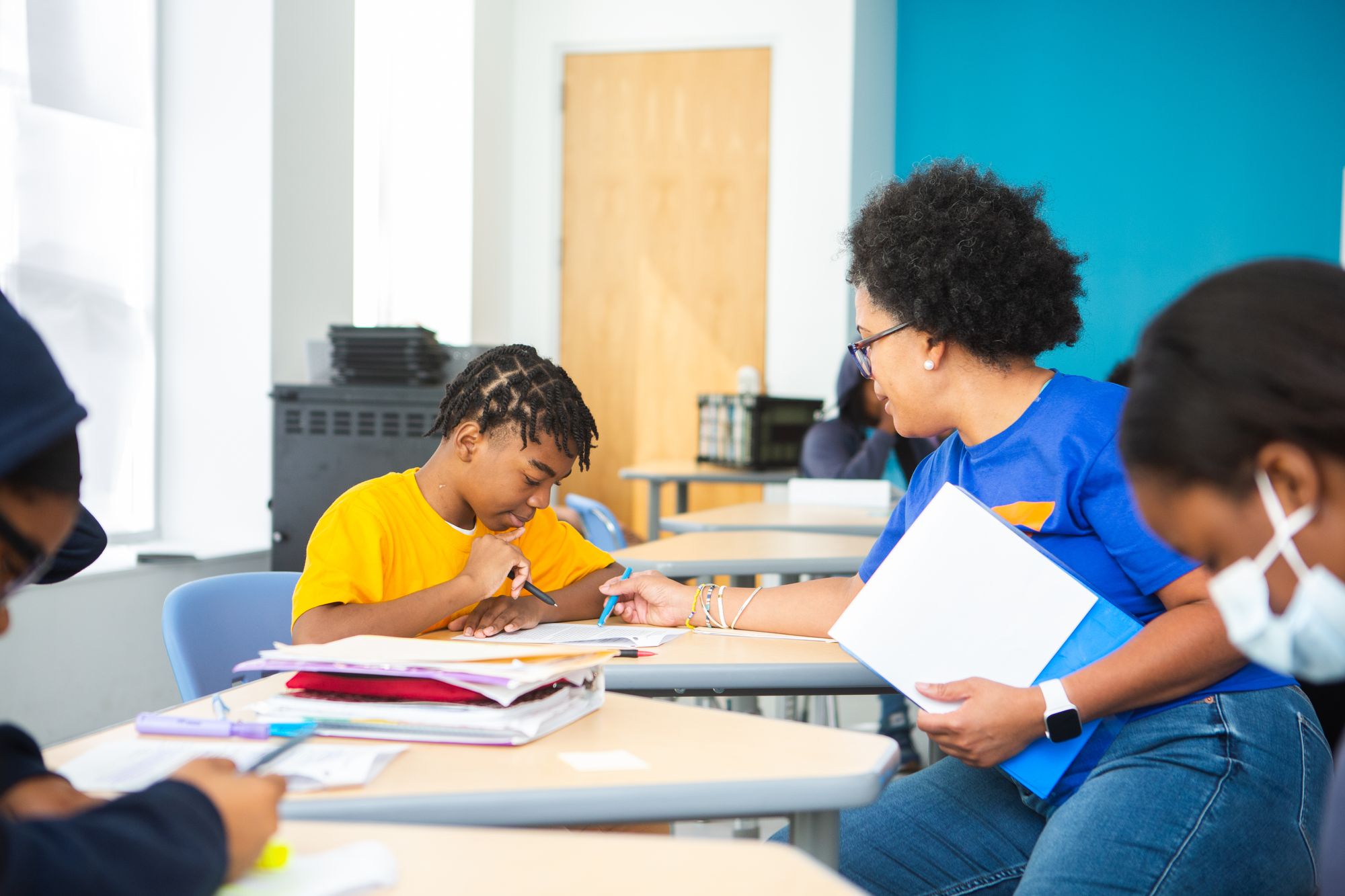 Teacher and student working on a CommonLit lesson