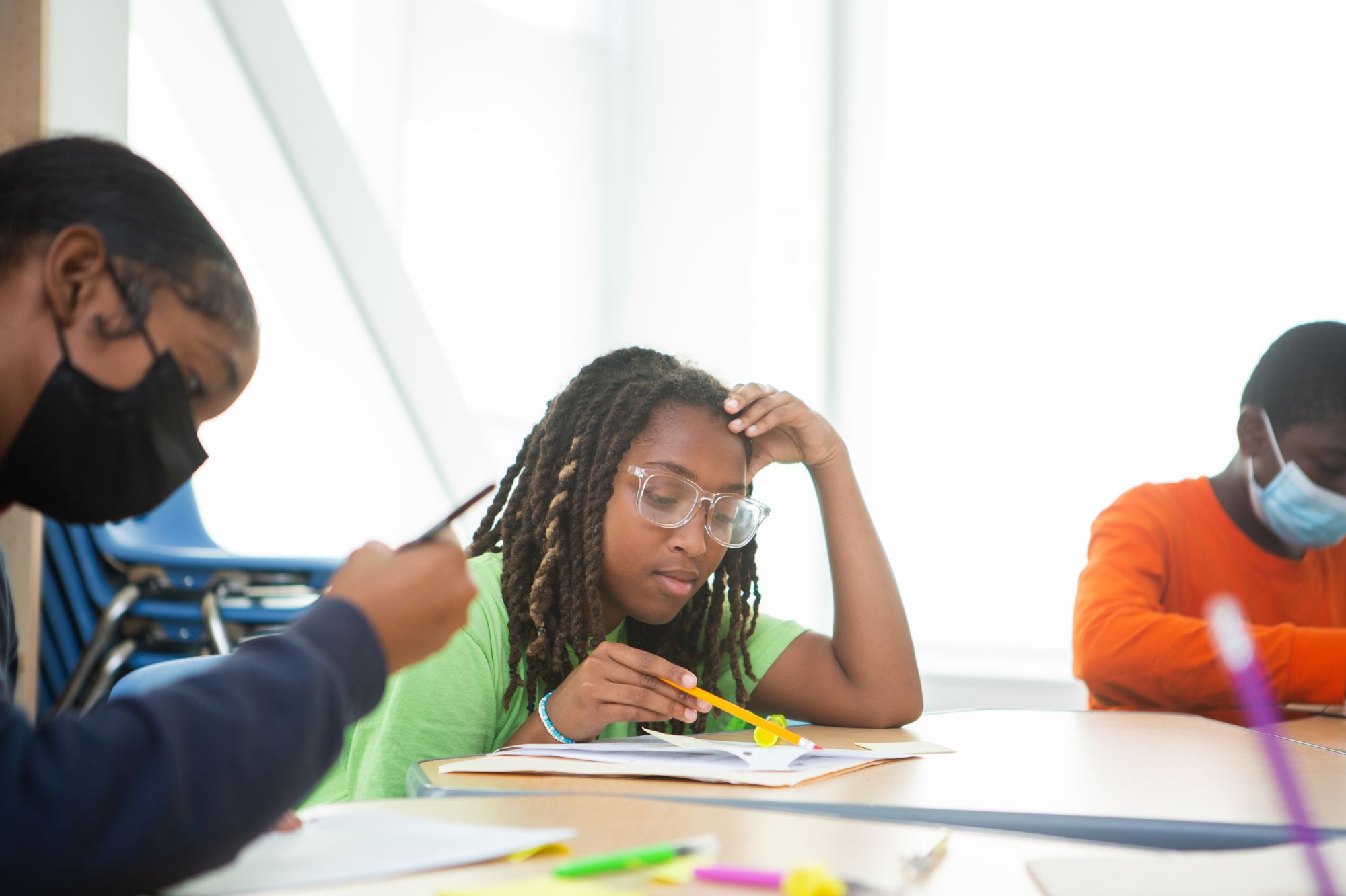 A student annotates a text.
