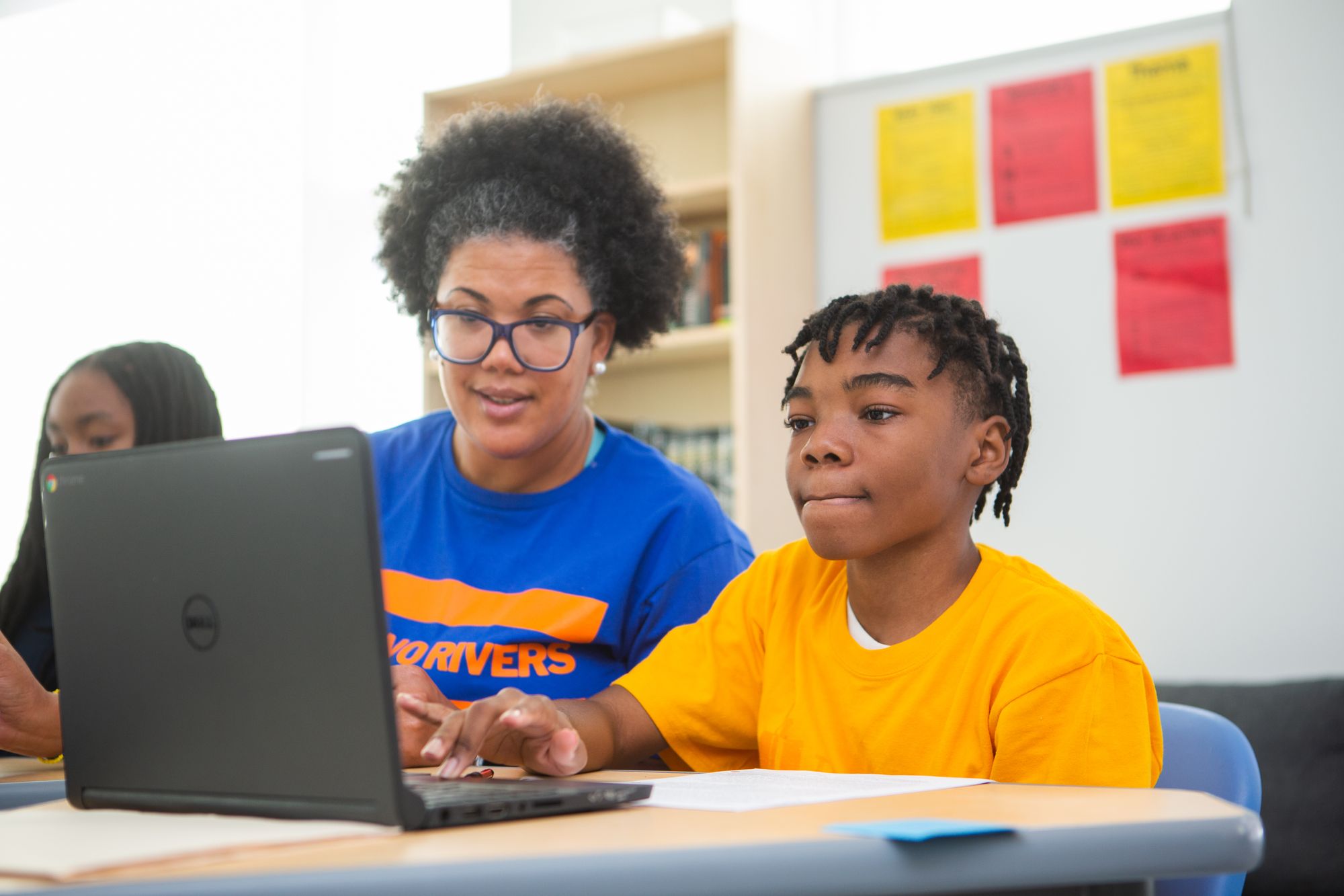 Teacher giving student a CommonLit Target Lesson