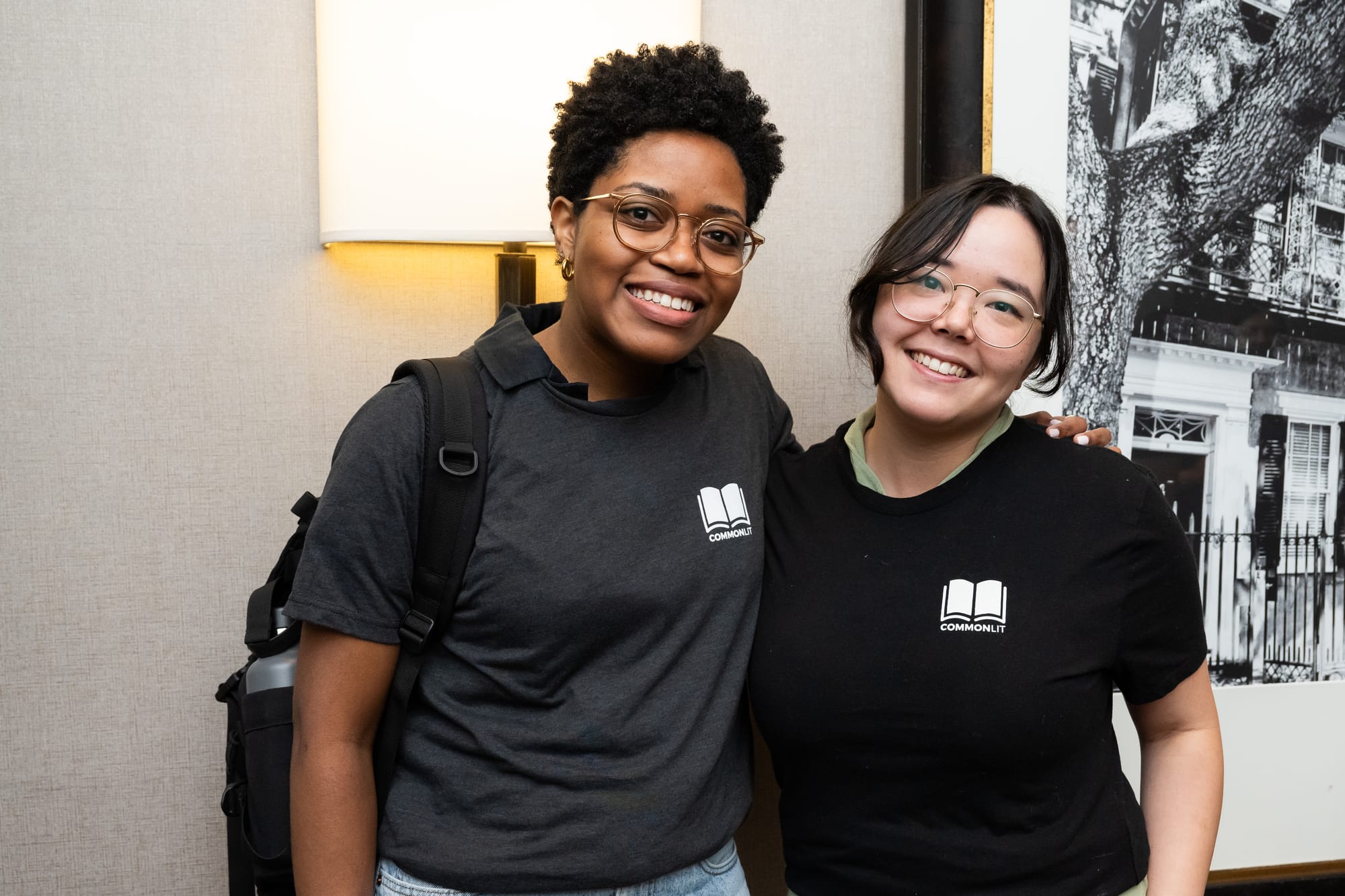 Two smiling women in CommonLit t-shirts 